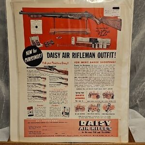 Daisy Air Rifleman Outfit Poster with Red and White Design